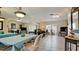 Dining area with table, chairs, and mirror reflecting living room at 2044 Canal Dr # M37, Bradenton, FL 34207