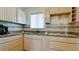 Well-equipped kitchen with ample cabinetry and granite countertops at 2044 Canal Dr # M37, Bradenton, FL 34207