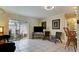 Relaxing living room with tiled floors, wicker chairs, and access to a screened porch at 2044 Canal Dr # M37, Bradenton, FL 34207