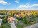 Aerial view of a single-Gathering home with a large backyard and surrounding landscape at 21264 Wynyard Ave, Port Charlotte, FL 33954