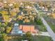 An aerial view of a home with a pool and screened enclosure at 21264 Wynyard Ave, Port Charlotte, FL 33954