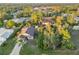 Aerial view showcasing a house with a fenced pool and surrounding vegetation at 21264 Wynyard Ave, Port Charlotte, FL 33954