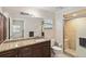 Modern bathroom with granite countertops and a walk-in shower at 21264 Wynyard Ave, Port Charlotte, FL 33954