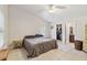 Bright bedroom with a queen-size bed and ensuite bathroom access at 21264 Wynyard Ave, Port Charlotte, FL 33954