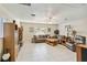 Living room showcasing comfortable seating and built-in shelving at 21264 Wynyard Ave, Port Charlotte, FL 33954