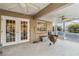 Covered patio with French doors and ceiling fans at 21264 Wynyard Ave, Port Charlotte, FL 33954