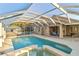 Inviting pool and spa with screened enclosure at 21264 Wynyard Ave, Port Charlotte, FL 33954