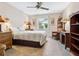 Bedroom with wicker furniture and ceiling fan at 2153 Pueblo Cir # V14, Sarasota, FL 34231