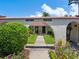 Attractive walkway leads to two-unit building with arched entryways at 2153 Pueblo Cir # V14, Sarasota, FL 34231