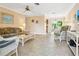 Bright living room with white wicker furniture and tile floors at 2153 Pueblo Cir # V14, Sarasota, FL 34231