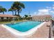 Community pool with lounge chairs for residents at 2153 Pueblo Cir # V14, Sarasota, FL 34231