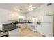 Bright kitchen with white cabinets and granite countertops at 2711 Larkspur Dr, Punta Gorda, FL 33950