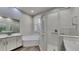 Elegant bathroom with soaking tub, walk-in shower, and modern vanity at 2914 112Th E Ter, Parrish, FL 34219