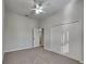 Well-lit bedroom with ceiling fan, double door closet and carpet flooring at 2914 112Th E Ter, Parrish, FL 34219