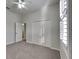 Bright bedroom featuring ceiling fan, double door closet and carpet flooring at 2914 112Th E Ter, Parrish, FL 34219