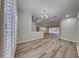 Bright dining room with wood-look floors and large windows at 2914 112Th E Ter, Parrish, FL 34219