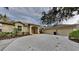 House exterior showcasing a three-car garage and well-manicured landscaping at 2914 112Th E Ter, Parrish, FL 34219