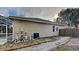 Rear view of home showing pool equipment and a small pathway at 2914 112Th E Ter, Parrish, FL 34219