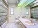 Bright bathroom with large mirror, tile floor, and shower/tub combo at 31 Bunker Pl, Rotonda West, FL 33947