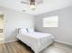 Bright bedroom with wood floors, window with blinds, and minimalist decor at 31 Bunker Pl, Rotonda West, FL 33947