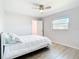 Neutral bedroom with a window and access to ensuite closet at 31 Bunker Pl, Rotonda West, FL 33947