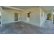 Covered back patio with access to backyard at 3107 34Th Avenue W Dr, Bradenton, FL 34205