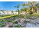 House backyard view with grass and trees at 3107 34Th Avenue W Dr, Bradenton, FL 34205