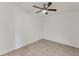 Bright bedroom with ceiling fan and tile floors at 3107 34Th Avenue W Dr, Bradenton, FL 34205