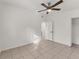 Bedroom with ceiling fan and access to bathroom at 3107 34Th Avenue W Dr, Bradenton, FL 34205