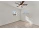 Bedroom with ceiling fan and two windows at 3107 34Th Avenue W Dr, Bradenton, FL 34205