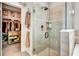 Modern bathroom with a large walk-in shower and adjacent closet at 3218 Big Sky Way, Bradenton, FL 34211