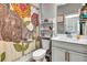 Clean bathroom with a modern vanity and patterned shower curtain at 3218 Big Sky Way, Bradenton, FL 34211