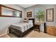 Cozy bedroom with a dark wood bed frame at 3218 Big Sky Way, Bradenton, FL 34211