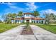 Community clubhouse with Spanish-style architecture and palm trees at 3218 Big Sky Way, Bradenton, FL 34211