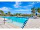 Community pool with ample deck space and lounge chairs at 3218 Big Sky Way, Bradenton, FL 34211