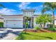 Single story house with tile roof and stone accents at 3218 Big Sky Way, Bradenton, FL 34211