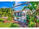 Peaceful backyard with hammocks and lush landscaping at 3218 Big Sky Way, Bradenton, FL 34211