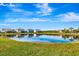 Community lakefront homes with lush landscaping and scenic views at 3218 Big Sky Way, Bradenton, FL 34211