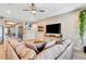 Relaxing living room featuring a sectional sofa and decorative wall at 3218 Big Sky Way, Bradenton, FL 34211