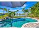 Relaxing pool area with a view of a lake at 3218 Big Sky Way, Bradenton, FL 34211