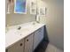 Double vanity bathroom with updated sinks and mirrors at 3230 Banyan Ter, Sarasota, FL 34237