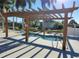 Relaxing hot tub under a shaded pergola at 3230 Banyan Ter, Sarasota, FL 34237