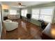 Living room with laminate flooring, sofa, and a TV at 3230 Banyan Ter, Sarasota, FL 34237