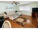 Bright living room with a comfortable sectional sofa and wood flooring at 3230 Banyan Ter, Sarasota, FL 34237