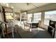 Bright sunroom with dining area and comfy seating at 3230 Banyan Ter, Sarasota, FL 34237