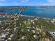 Aerial view of waterfront property with homes and lush landscaping at 3331 Old Oak Dr, Sarasota, FL 34239