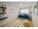 Bedroom with daybed and colorful rug at 3331 Old Oak Dr, Sarasota, FL 34239