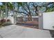 Ornate, dark metal gate leading to a home with brick driveway at 3331 Old Oak Dr, Sarasota, FL 34239