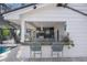 Outdoor kitchen with counter seating and a built-in grill at 3331 Old Oak Dr, Sarasota, FL 34239