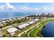 Aerial view of a beautiful home near the golf course and bay at 3491 Byron Ln, Longboat Key, FL 34228